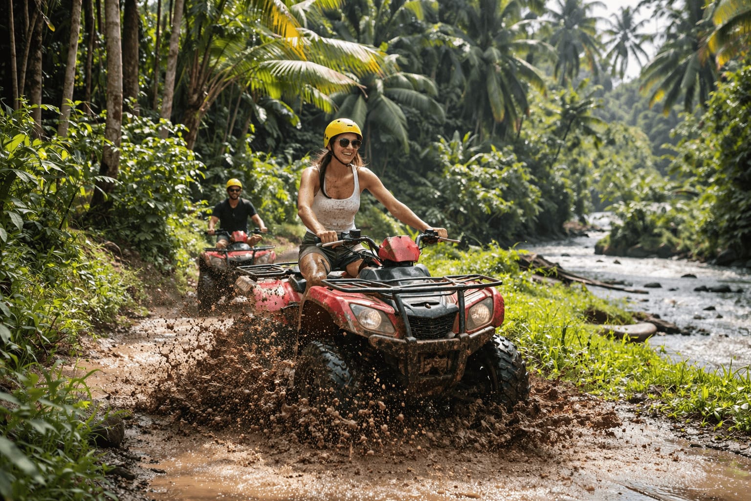 ATV rider crossing muddy jungle trail in Ubud Bali during adventure tour